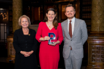 Theo Clarke MP holding her award for Best Political Speech of the Year, flanked by Dame Rosie Winterton and Pagefield's Oliver Foster